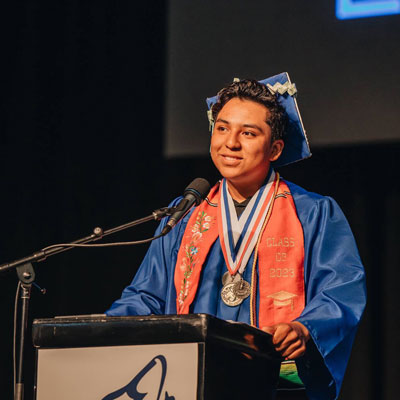 Empower College Prep graduate in cap and gown